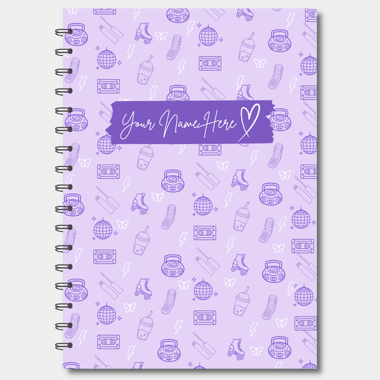 Purple notebook with retro pattern and customizable name space on a white background
