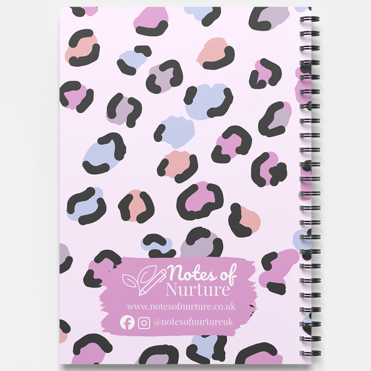 Notebook with pastel leopard print design and 'Notes of Nurture' branding on a light purple background.