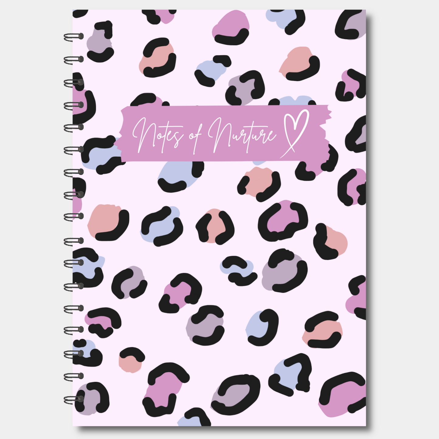 Notebook with pink and black leopard print cover and 'Notes of Nurture' text on a white background